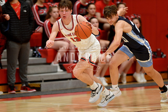 Kellen Driscoll (13) heads for the basket after stealing the bal