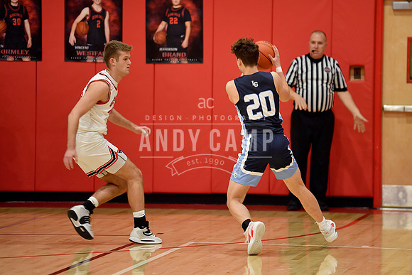 Nathan Hohman (20) looks to drive to the basket against Cooper N