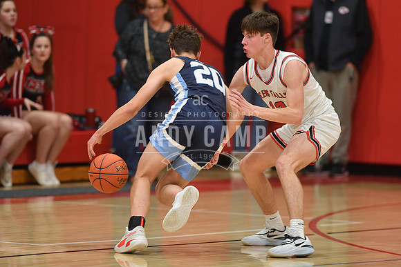 Nathan Hohman (20) tries to drive past Kellen Driscoll of Glens