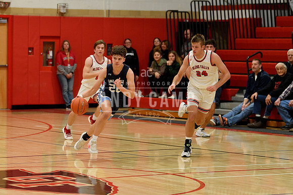 Nathan Hohman (20) brings the ball up against Cooper Nadler (24)
