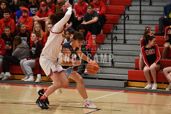 nathan Hohman (20) is guarded tightly by Aiden Harrington of Gle